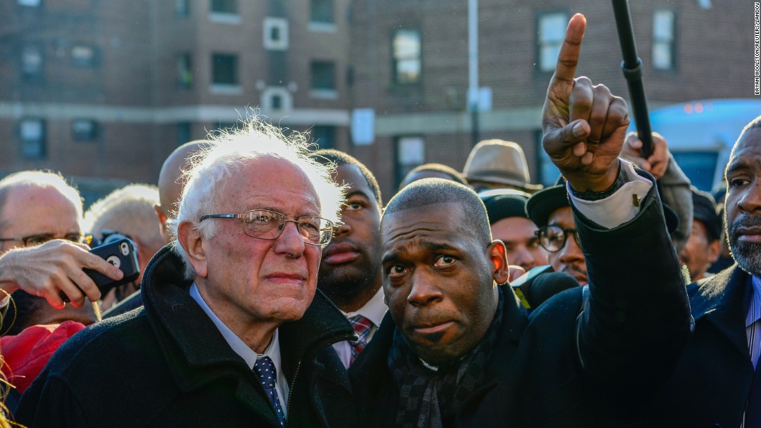 Pastor Jamal Bryant points something out to U.S. Sen. Bernie Sanders on Tuesday, December 8, as the presidential candidate &lt;a href=&quot;http://www.cnn.com/2015/12/08/politics/bernie-sanders-freddie-gray-baltimore-2016/&quot; target=&quot;_blank&quot;&gt;toured the Baltimore neighborhood&lt;/a&gt; where violence erupted after the death of Freddie Gray earlier this year. Gray, 25, died in police custody in April. According to his attorney, he died from a severe spinal cord injury he received while in police custody. The case raised long-simmering tensions between police and residents, and six police officers have been charged in connection with Gray&#39;s death.