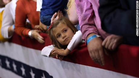 AVON LAKE, OH - OCTOBER 29: A young girls looks on during a campaign rally for Republican presidential candidate, former Massachusetts Gov. Mitt Romney at Avon Lake High School on October 29, 2012 in Avon Lake, Ohio. Romney has canceled other campaign events on October 29 and 30 due to Hurrcane Sandy.  (Photo by Justin Sullivan/Getty Images)