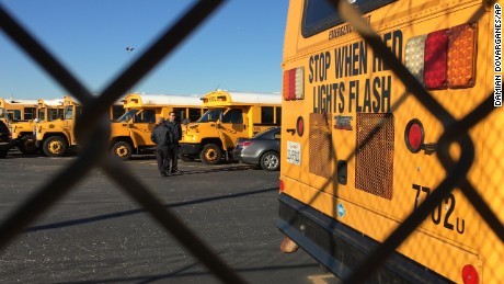 Los Angeles Unified School District buses stand idle in Gardena, Calif., on Tuesday, Dec. 15, 2015.  All Los Angeles area public schools were shut down Tuesday after a after a school board member received an emailed threat that raised fears of another attack like the deadly shooting in nearby San Bernardino. (AP Photo/Damian Dovarganes)