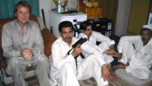 2009: A chance encounter with a forger in Kandahar, Afghanistan, led to a smuggler's bazaar. Drury is pictured here with some of the traders. 