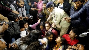 The Delhi Police detain the mother of the victim, along with protestors in New Dehli.