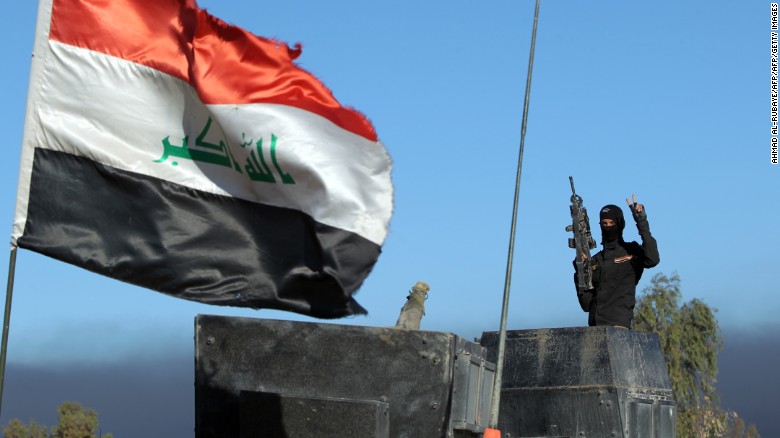 A member of Iraq&#39;s counter-terrorism forces gestures as they enter the Tameem district of Ramadi, a large city on the Euphrates 100 kilometres (60 miles) west of Baghdad on December 9, 2015. Iraqi forces consolidated newly gained positions in Ramadi, after achieving a breakthrough in their fight against the Islamic State (IS) group by retaking a large part of the city. / AFP / AHMAD AL-RUBAYE (Photo credit should read AHMAD AL-RUBAYE/AFP/Getty Images)