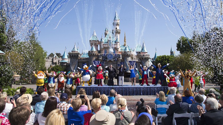 ANAHEIM, CA - JULY 17:  In this handout photo provided by Disney parks, Mickey Mouse and his friends celebrate the 60th anniversary of Disneyland park during a ceremony at Sleeping Beauty Castle featuring Academy Award-winning composer, Richard Sherman and Broadway actress and singer Ashley Brown July 17, 2015 in Anaheim, California.  Celebrating six decades of magic, the Disneyland Resort Diamond Celebration features three new nighttime spectaculars that immerse guests in the worlds of Disney stories like never before with &quot;Paint the Night,&quot; the first all-LED parade at the resort; &quot;Disneyland Forever,&quot; a reinvention of classic fireworks that adds projections to pyrotechnics to transform the park experience; and a moving new version of &quot;World of Color&quot; that celebrates Walt Disneys dream for Disneyland.  (Photo by Paul Hiffmeyer/Disneyland Resort via Getty Images)