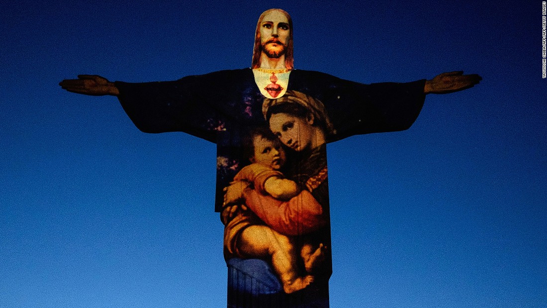 Rio&#39;s most famous icon, the statue of Christ the Redeemer, was illuminated by Brazil-based French lighting designer Gaspare Di Caro atop Corcovado hill on December 23. 