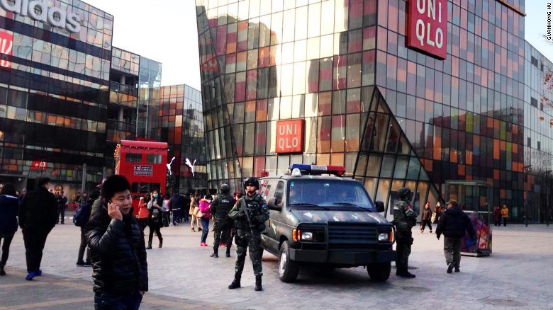 Armed police officers patrol the Sanlitun area of Beijing on December 24, 2015. The British and U.S. embassies in China say they have received information of possible threats against Westerners at and around Christmas in the popular district home to a high-end, open-plan mall and some of Beijing&#39;s best dining in Western cuisines.