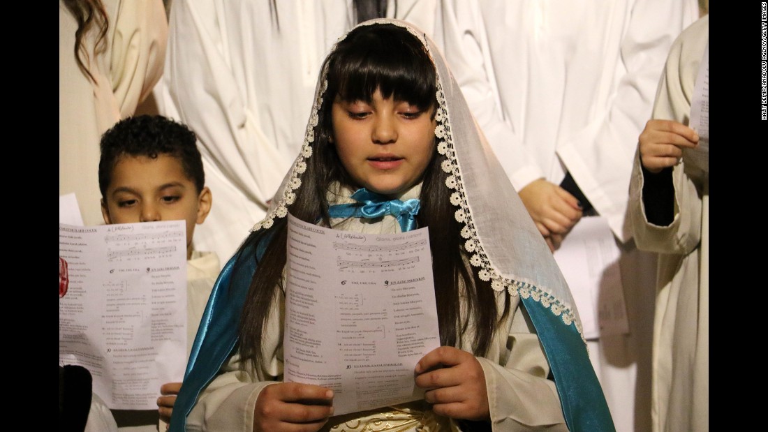 Children sing in a chorus during a Christmas church service at Antakya Orthodox Church in Hatay, Turkey, on Thursday.