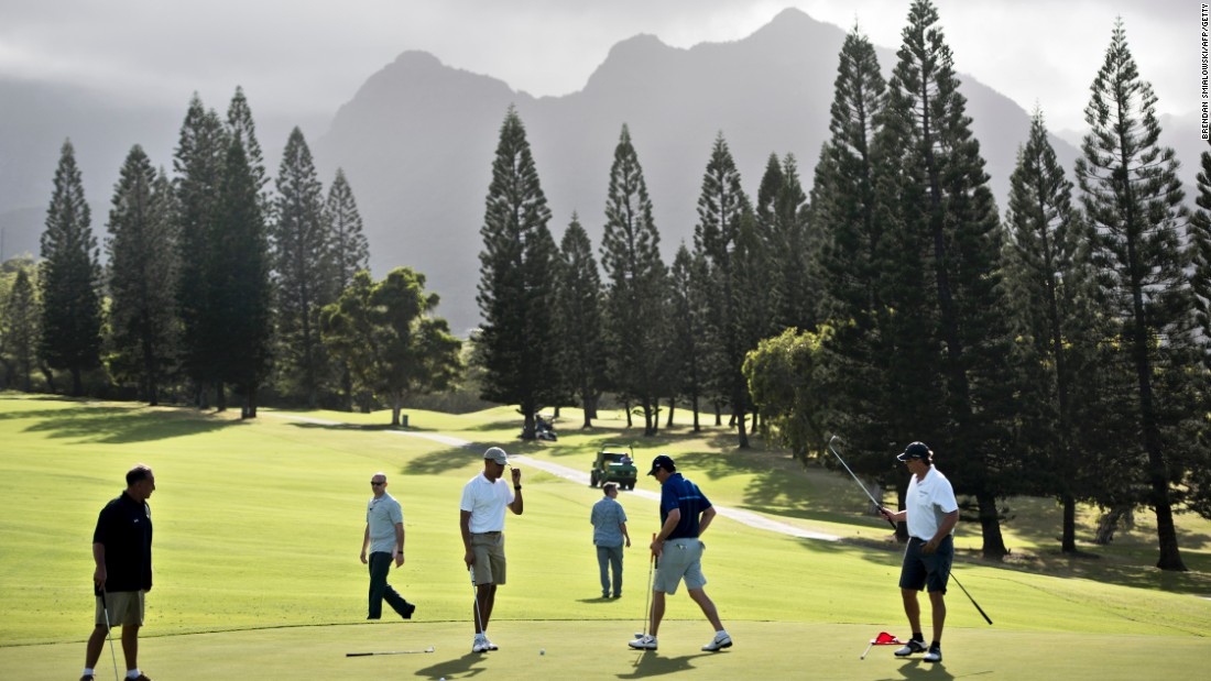 Obama golfs with longtime friends and former schoolmates from Hawaii: Bobby Titcomb, from left, Obama, Mike Ramos and Greg Orme walk on the 18th green. Secret Service agents are in the background.