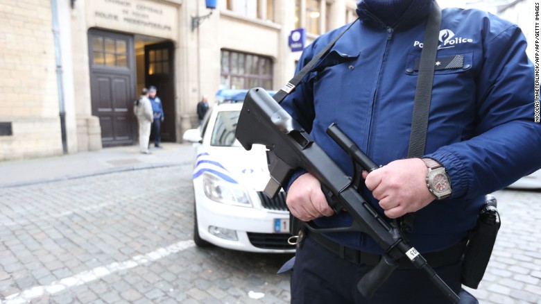 A police officer stands outside a police station, on December 29, 2015, in Brussels. After several searches in Brussels, Vlaams-Brabant and Liege the past two days, two suspects were arrested. They are suspected of being part of a terrorist cell that may have planned several attacks in the Brussels city center. At this point it is assumed there are no links to the November Paris attacks. Terror alert level around Brussels police station is raised from 2 to 3. / AFP / BELGA AND Belga / NICOLAS MAETERLINCK / Belgium OUTNICOLAS MAETERLINCK/AFP/Getty Images