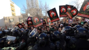 Iranian protesters hold portraits of prominent Shiite Muslim cleric Nimr al-Nimr as they confront riot police during a demonstration against his execution by Saudi authorities on Sunday, January 3, outside the Saudi embassy in Tehran, Iran. Saudi Foreign Minister Adel al-Jubeir told reporters that&lt;a href=&quot;http://www.cnn.com/2016/01/03/middleeast/saudi-arabia-executes-dozens-terror/index.html&quot; target=&quot;_blank&quot;&gt; Saudi Arabia is severing ties with Iran &lt;/a&gt;after an attack on the embassy.