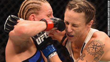 LAS VEGAS, NV - JANUARY 02: (L-R) Justine Kish punches Nina Ansaroff in their women's strawweight bout during the UFC 195 event inside MGM Grand Garden Arena on January 2, 2016 in Las Vegas, Nevada.  (Photo by Josh Hedges/Zuffa LLC/Zuffa LLC via Getty Images)