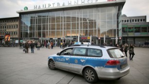 A police car passes the central railway station in Cologne, Germany near where a series of sex assaults allegedly occurred on New Year&#39;s Eve.