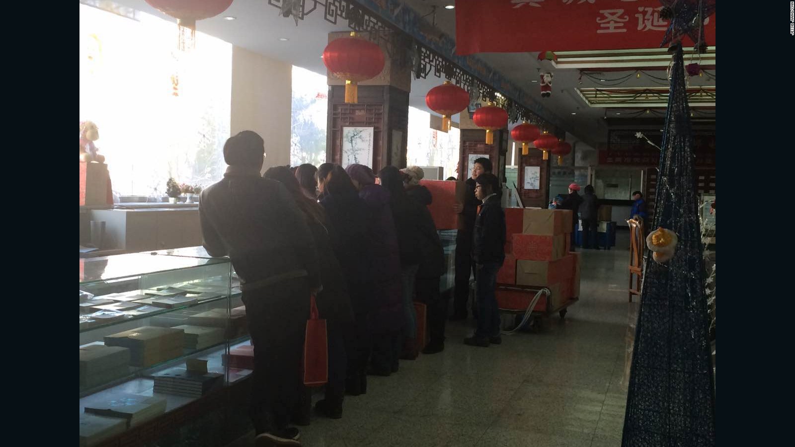 People line up to buy the special monkey stamps in a Beijing post office on Wednesday, January 6, 2016.