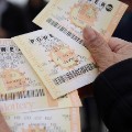 Powerball tickets are shown Saturday, Jan. 9, 2016, in San Lorenzo, Calif. Ticket sales for the multi-state Powerball lottery soared Saturday as people dreamed of winning the largest jackpot in U.S. history, which grew by $100 million to hit $900 million just hours before Saturday night's drawing. (AP Photo/Marcio Jose Sanchez)