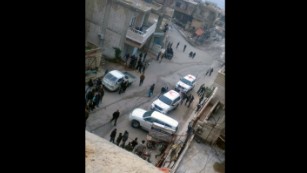 A photo taken by a local councilman shows cars belonging to aid agencies arriving in Madaya on Monday.
