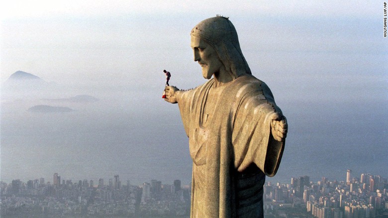 30 year-old Austrian parachutist Felix Baumgartner prepares to jump from the arm of the giant Jesus statue above the Brazilian metropolis Rio de Janeiro, Wednesday, Dec. 1, 1999.