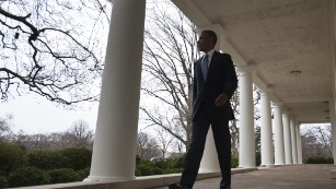 President Obama walks through the Colonnade from the Oval Office on Tuesday.