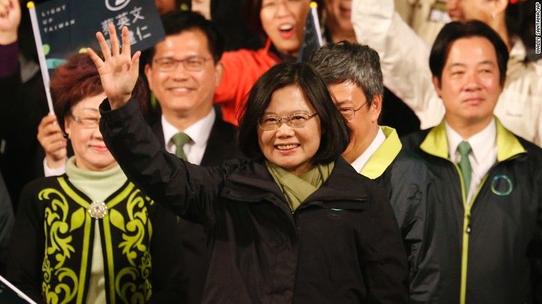 Democratic Progressive Party candidate Tsai Ing-wen raises her hands as she declares victory in the presidential election on Saturday, January 16 in Taipei.