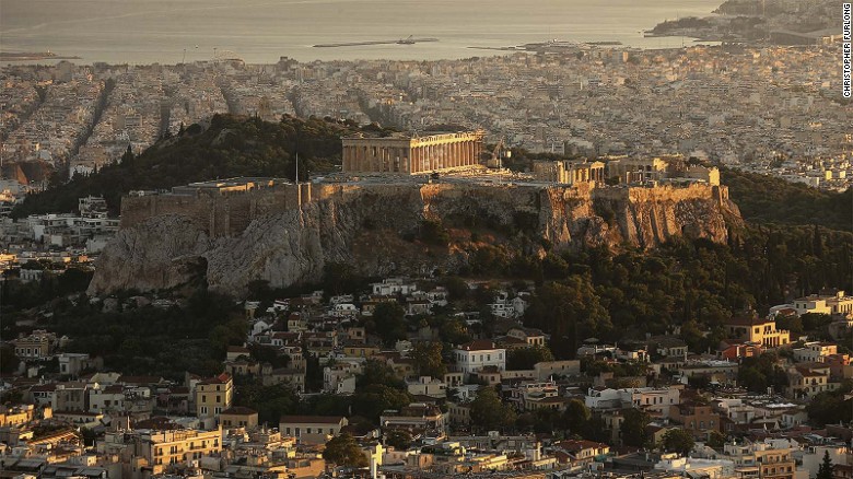 Adjacent to The Acropolis, pictured, Koukaki sits at the bottom of the Lofos Filopappou and is home to some ancient treasures of its own. &quot;After it became a pedestrian playground, the street morphed to have a cafe-like feel with all of the restaurants and bars placing tables and chairs outside,&quot; says the Airbnb report.  