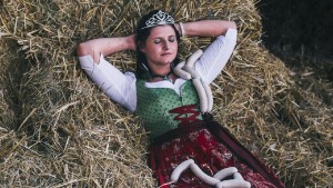 Portrait of the Queen of the bavarian_veal_sausage. Taken in a staple in Münchsteinach. She held the titel from 2014 to 2015. This picture belongs to the series: Twelve Queens. 
These queens are symbolic figures who volunteer for their region or town.
They are present at openings and celebrations and functions as a dialog partner and ambassador in public.