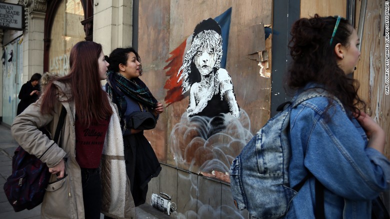 New artwork by street artist Banksy depicts a young girl from the musical Les Miserables with tears in her eyes as teargas moves towards her. It is the artist&#39;s latest work which aims to confront confronting the refugee crisis. Discover more...
