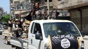 Fighters from Al-Qaeda&#39;s Syrian affiliate Al-Nusra Front drive in armed vehicles in the northern Syrian city of Aleppo as they head to a frontline, on May 26, 2015. Once Syria&#39;s economic powerhouse, Aleppo has been divided between government control in the city&#39;s west and rebel control in the east since shortly after fighting there began in mid-2012. AFP PHOTO / AMC / FADI AL-HALABI        (Photo credit should read Fadi al-Halabi/AFP/Getty Images)