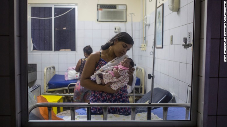 Cleane Serpa holds her 1-month-old cousin at a hospital in Recife on Friday, January 8. The child was born with microcephaly.