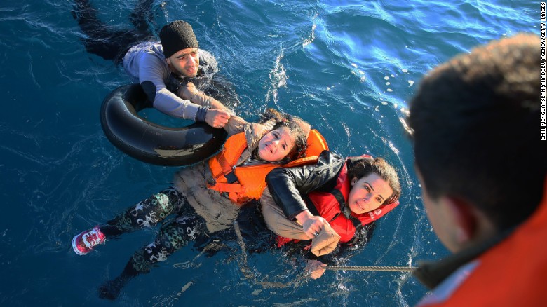 The Turkish coast guard helps refugees near Aydin, Turkey, after their boat toppled en route to Greece on Friday, January 22. More than 1 million refugees and migrants escaped to Europe in 2015, the U.N. refugee agency said. Click through to see images from the migration crisis in Europe.