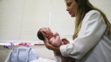 RECIFE, BRAZIL - JANUARY 27:  Dr. Vanessa Van Der Linden, the neuro-pediatrician who first recognized the microcephaly crisis in Brazil, examines a 2-month-old baby with microcephaly on January 27, 2016 in Recife, Brazil.  The baby&#39;s mother was diagnosed with having the Zika virus during her pregnancy. In the last four months, authorities have recorded close to 4,000 cases in Brazil in which the mosquito-borne Zika virus may have led to microcephaly in infants. The ailment results in an abnormally small head in newborns and is associated with various disorders including decreased brain development. According to the World Health Organization (WHO), the Zika virus outbreak is likely to spread throughout nearly all the Americas. At least twelve cases in the United States have now been confirmed by the CDC.  (Photo by Mario Tama/Getty Images)