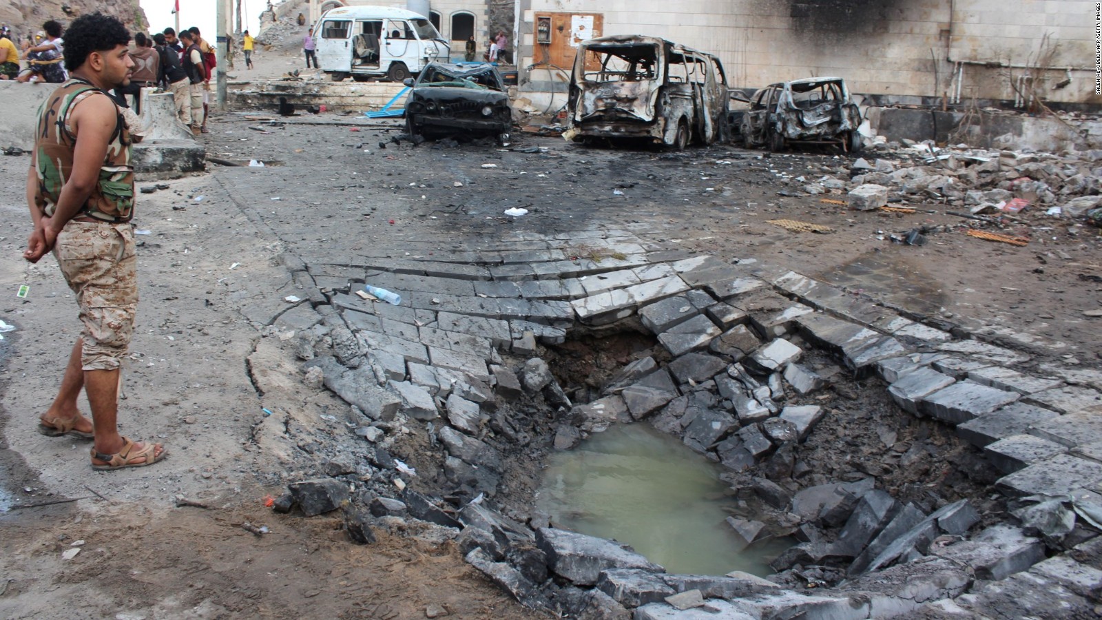 ISIS militants claimed responsibility for a suicide car bombing that killed at least 11 people, including two schoolchildren.