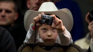 McCoy Wicker, 5, takes pictures of Republican presidential candidate Marco Rubio during a rally Saturday, January 30, in Council Bluffs, Iowa.