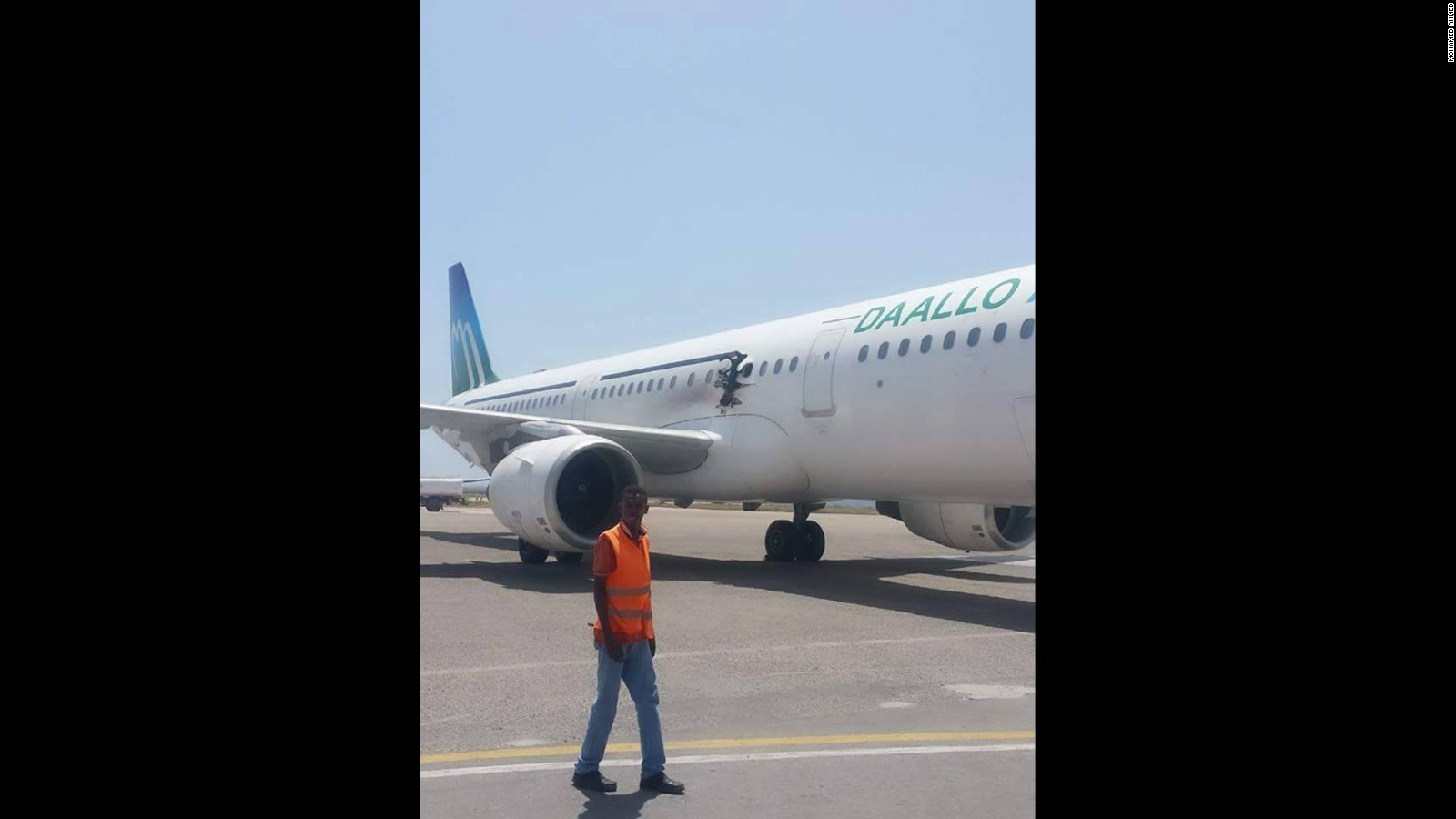 A photo of the jet shows a hole in just above its wing and slightly smaller than one of its doors.