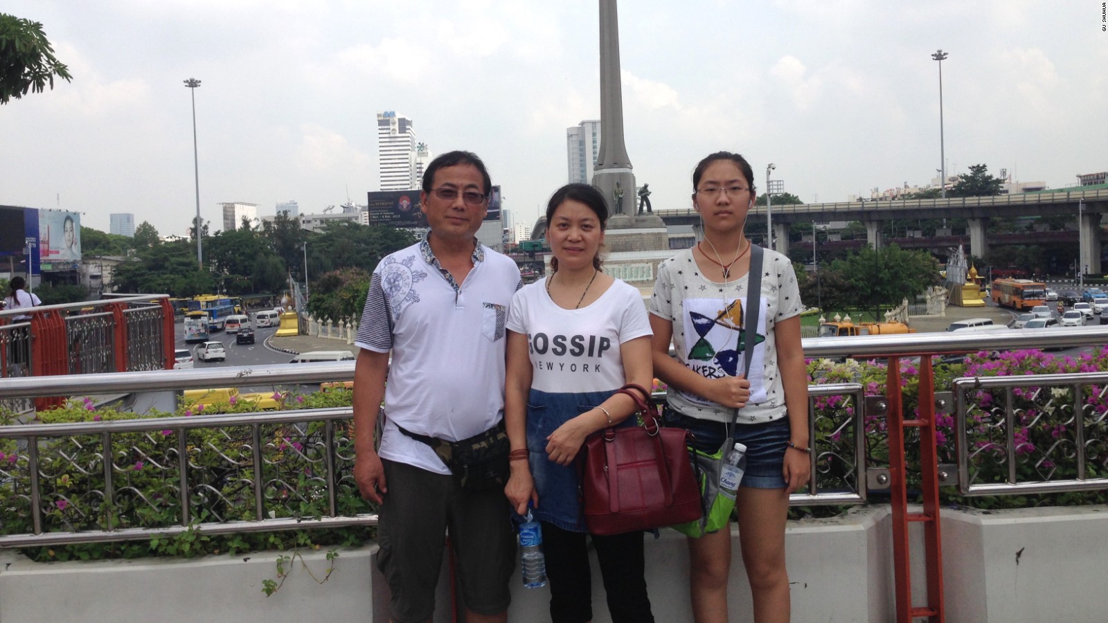 Dong Guangping, left, with his wife Gu Shuhua, and daughter in Bangkok on October 7, 2015 after handing in documents to the UNHCR.