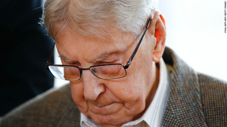 Former Auschwitz guard Reinhold Hanning, 94, arrives Thursday for his trial in Detmold, Germany.