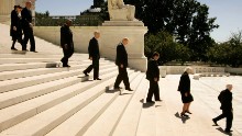 Members of the U.S. Supreme Court, Justice Ruth Bader Ginsburg, Justice Stephen Breyer, Justice Clarence Thomas, Justice David Souter, Justice William Kennedy, Justice Antonin Scalia, Justice Sandra Day O'Connor and Justice John Paul Stevens file out of the U.S. Supreme Court Building to attend funeral services for Chief Justice William Rehnquist on September 7, 2005, in Washington.