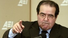 Scalia calls on people during a question-and-answer period at the American Enterprise Institute on February 21, 2006, in Washington. Scalia delivered the keynote address about foreign law and the debate about how it is used in American Law during the seminar called "Outsourcing Of American Law."