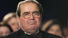 Scalia listens as U.S. President George W. Bush speaks at the the Federalist Society's 25th Anniversary Gala Dinner at Union Station in Washington, on November 15, 2007.