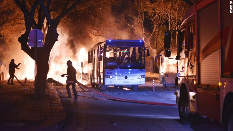 Firefighters work at a scene of fire from an explosion in Ankara, Wednesday, Feb. 17, 2016. A large explosion, believed to have been caused by a bomb, injured several people in the Turkish capital on Wednesday, according to media reports. Private NTV said the explosion occurred during rush hour in an area close to where military headquarters are located as a bus carrying military personnel was passing by. Several cars caught fire, the report said. Ambulances were seen rushing toward the scene. The explosion caused a large fire and dark smoke could be seen billowing from a distance. (IHA via AP) TURKEY OUT