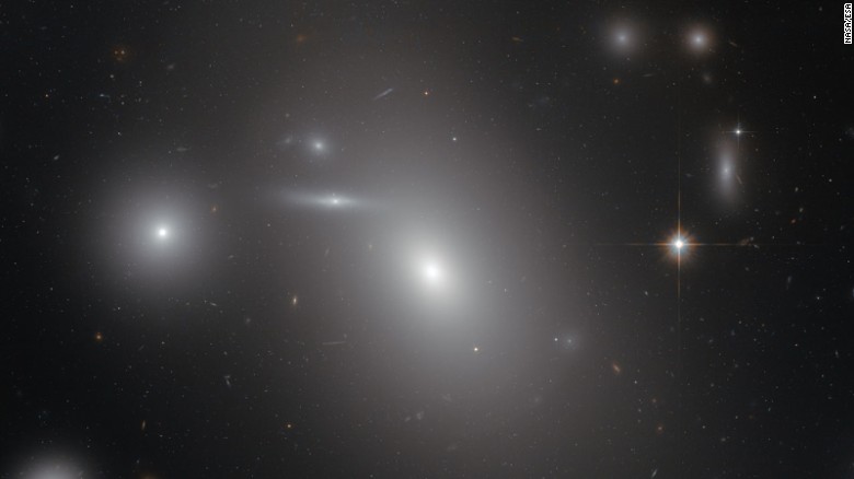This image shows the elliptical galaxy NGC 4889, deeply embedded within the Coma galaxy cluster. There is a gigantic supermassive black hole at the center of the galaxy.