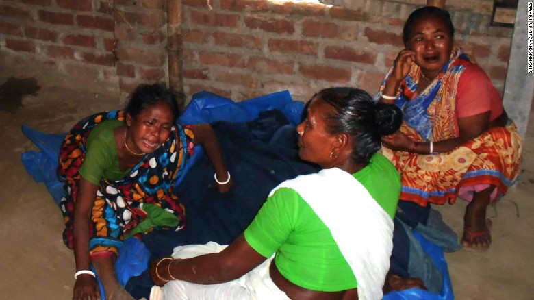 Relatives of a slain Hindu priest in Bangladesh mourn after the attack on Sunday.