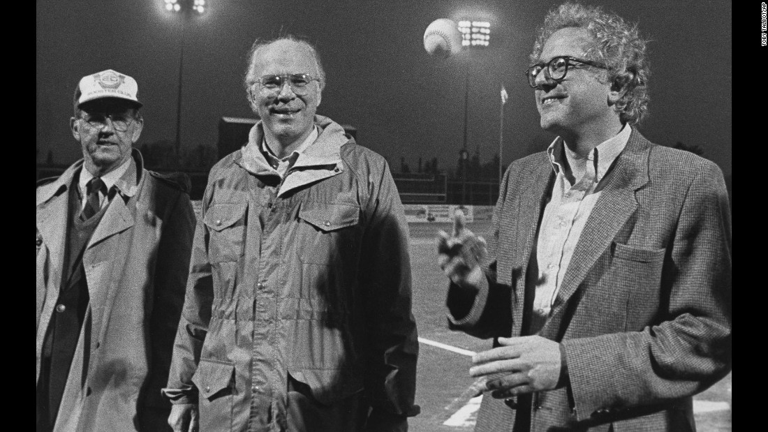 Sanders, right, tosses a baseball before a minor-league game in Vermont in 1984. U.S. Sen. Patrick Leahy, center, was also on hand.