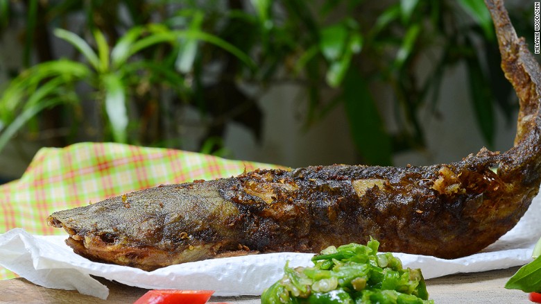 Fried catfish is usually served with rice and red and green sambal.