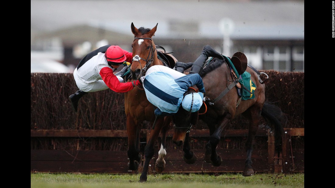 Victoria Pendleton, left, and Carey Williamson fall off their horses during a steeplechase race in Fakenham, England, on Friday, February 19. Pendleton is a former Olympic cyclist who won the keirin at the 2012 Games.