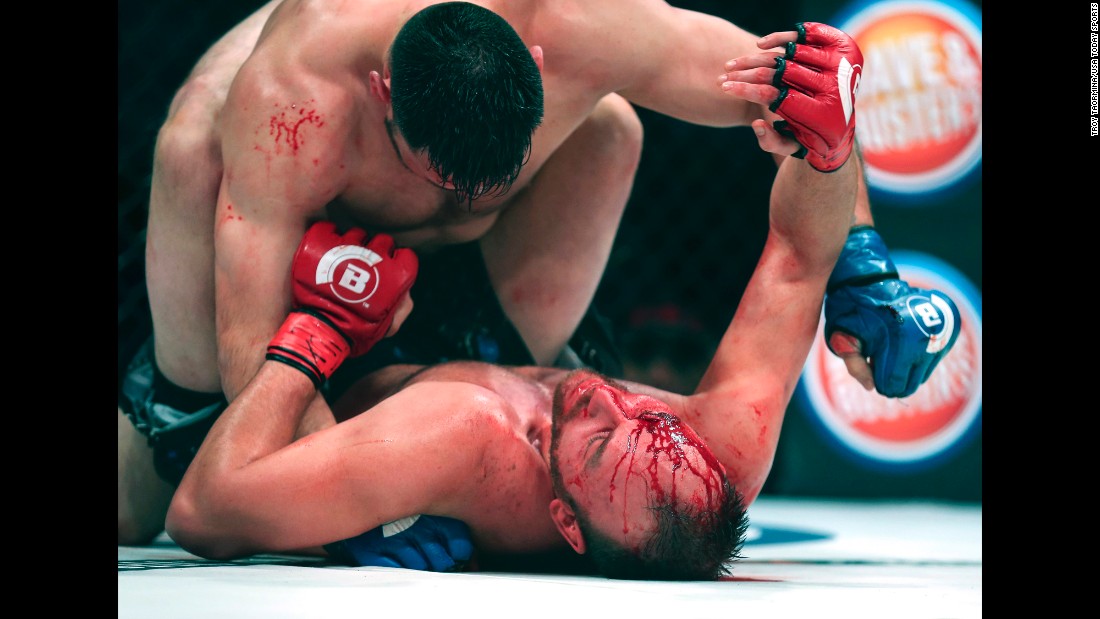 C.J. Hancock, bottom, tries to hold off Ruben Esparza during their Bellator bout in Houston on Friday, February 19. Hancock would win the fight with a rear-naked choke in the third round.