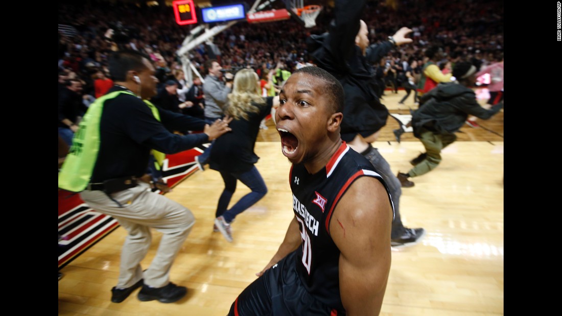 Texas Tech basketball player Toddrick Gotcher runs toward fans as they celebrate the team's home win over No. 3 Oklahoma on Wednesday, February 17.