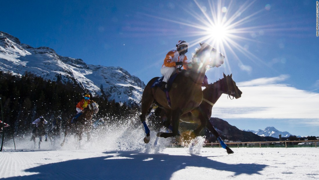 Horses race on a frozen lake in St. Moritz, Switzerland, on Sunday, February 21. <a href="<a href=