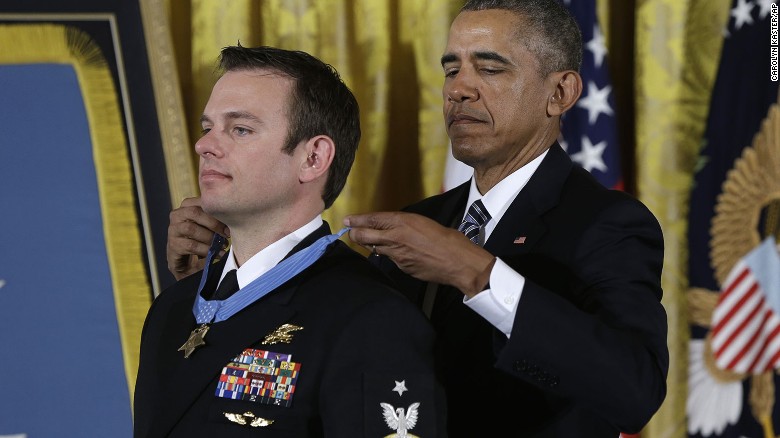 President Barack Obama presents the Medal of Honor to Senior Chief Special Warfare Operator Edward Byers during a ceremony in the East Room of the White House in Washington, Monday, Feb. 29, 2016. Byers received the Medal of Honor for his courageous actions while serving as part of a team that rescued an American civilian being held hostage in Afghanistan on December 8-9, 2012. (AP Photo/Carolyn Kaster)