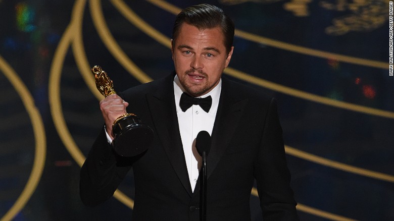 Actor Leonardo DiCaprio accepts the award for Best Actor in,The Revenant  on stage at the 88th Oscars on February 28, 2016 in Hollywood, California. AFP PHOTO / MARK RALSTON / AFP / MARK RALSTON        (Photo credit should read MARK RALSTON/AFP/Getty Images)