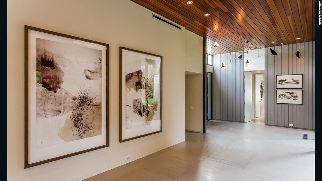 The property&#39;s interiors feature floor-to-ceiling glass walls, wooden ceilings and stone walls.