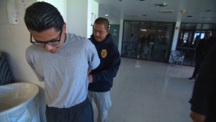 Security is vigilant at Barry Nidorf Juvenile Hall in Sylmar, California, where Carlos Adrian Vazquez Jr. is being handcuffed.