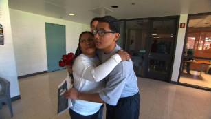 Carlos Adrian Vazquez Jr. hugs his mother, Adriana Garcia, in juvenile jail.